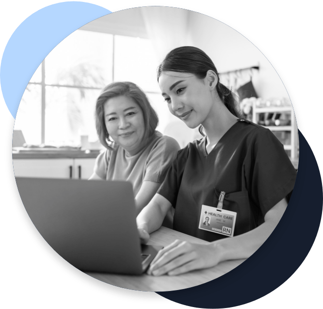 home health nurse helping a patient look something up on a laptop