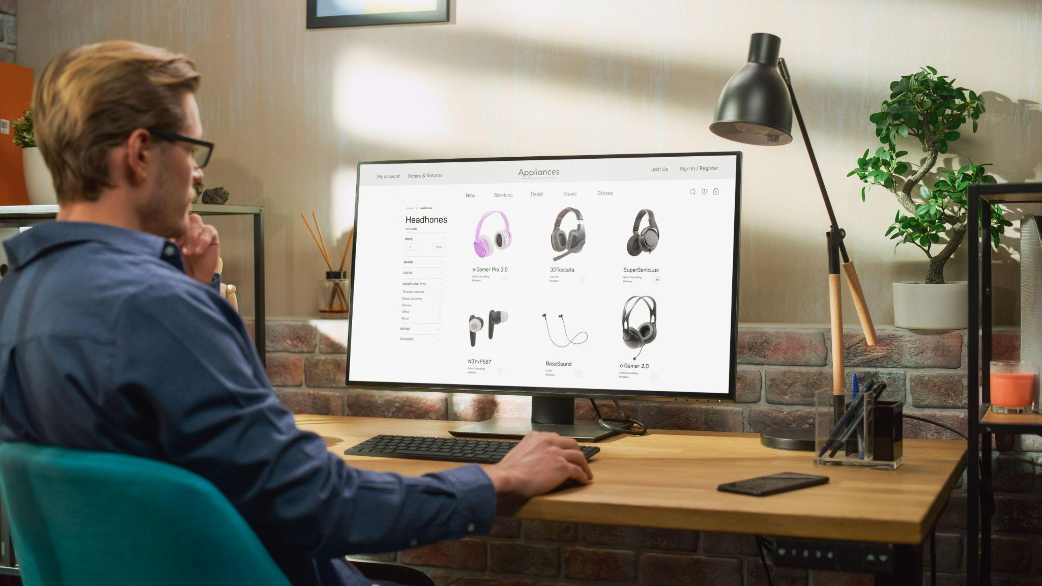 Man sitting at computer browsing products on ecommerce website